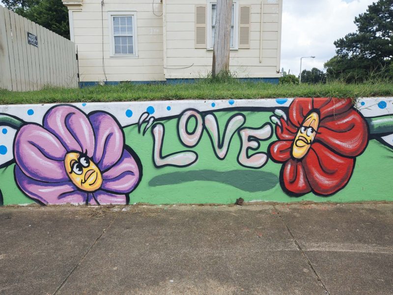 A mural adorns a retaining wall behind Treadwell elementary and middle schools in The Heights. (Ziggy Mack)