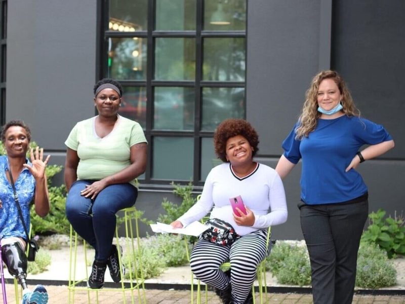 Guests of the Hub Hotel pose with Shelby Stonecipher (far right), Hub Hotel program manager. (Courtesy of Hospitality Hub)