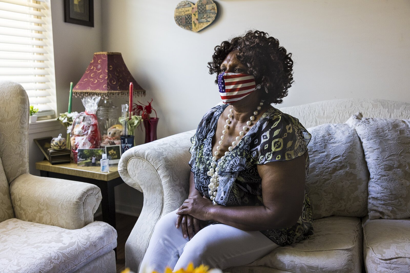 Denise Oher sits for a portrait inside her home in the Foote Park at South City. The development is mixed-income, meaning some units are reserved for government-subsidized housing and some units are full market price. (Ziggy Mack)