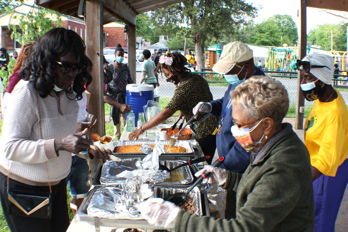 Cydni Moonflower, Talbert Fleming, and Vivian Walker serve their dishes to Knowledge Quest parents. (Cole Bradley)