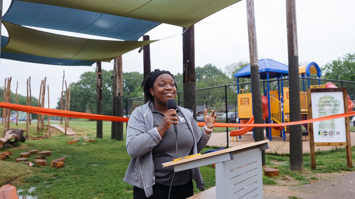 Heights CDC Community Coordinator Christina Crutchfield speaks at the Treadwell Park nature playground ribbon cutting ceremony in the Nutbush area of The Heights. (Ziggy Mack)