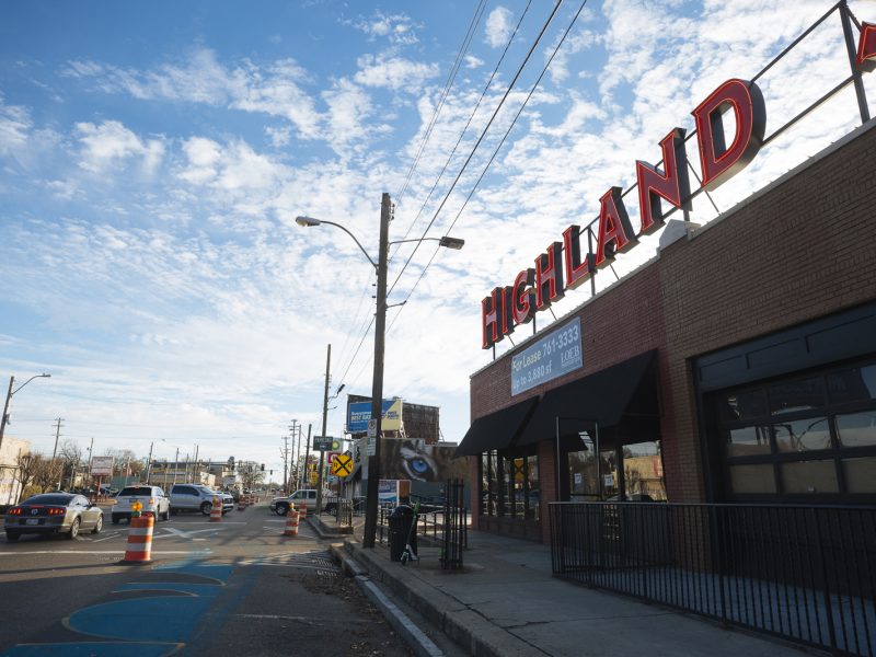 The Highland Strip features a bold sign to brand the area. Traffic cones mark recent street improvements. (Ziggy Mack)