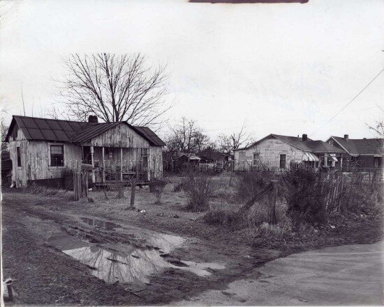 This image was taken just before Boxtown's annexation into the City of Memphis in the 1960s. Large, muddy holes surround the homes. (University of Memphis Libraries)
