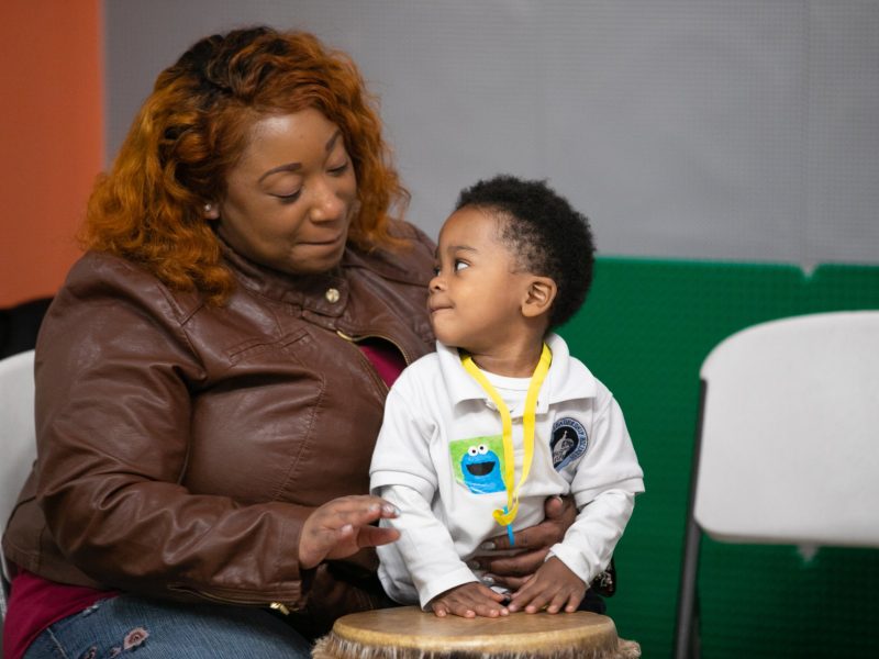 A parent and child make music in a drum circle at the Knowledge Question Universal Parenting Place in South Memphis. (Submitted)