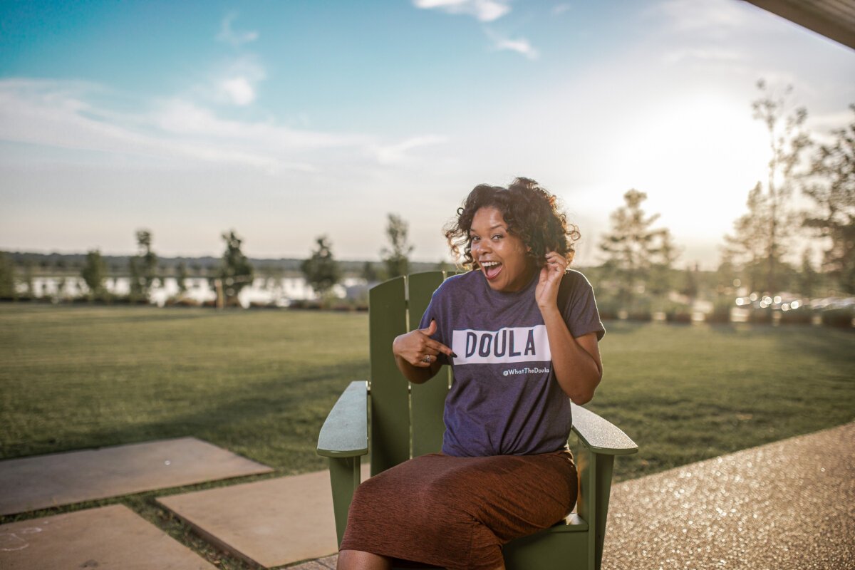Kaila Matthews, pictured here in her company shirt, is a doula with a focus on helping expectant Black parents through pregnancy, birth, and postpartum. (Submitted) 