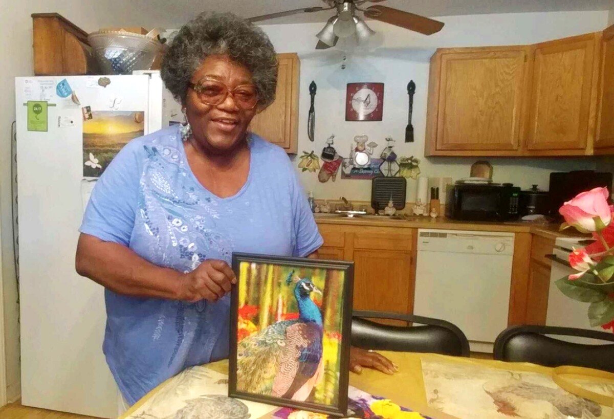 Derotha Payne-Obie displays a mounted and framed puzzle she completed at her home. Prior to the pandemic, she keep busy at the Lewis Senior Center's day program. It's been closed since March by local and state mandates. (Tamara Cunningham)