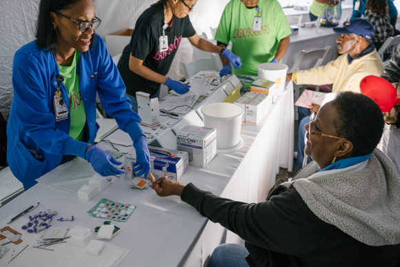 Betty Jones has her blood glucose levels checked at Methodist South's Whitehaven Healthy Community Day, 2018. (Brandon Dahlberg)