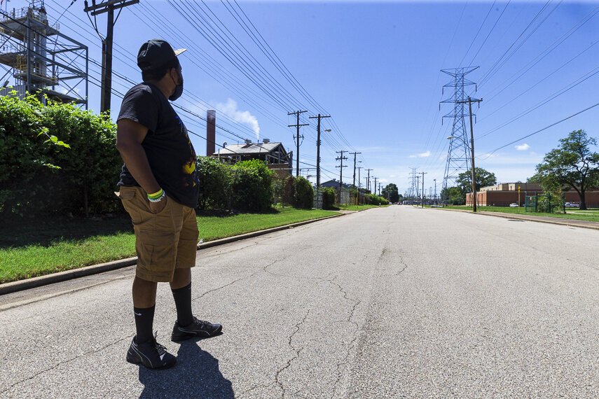 Frank Johnson faces the Penn A Kem, LLC chemical plant across the street Douglass High School in the Douglass area of North Memphis. Johnson is an expert on environmental racism in North Memphis. 2020. (Ziggy Mack)