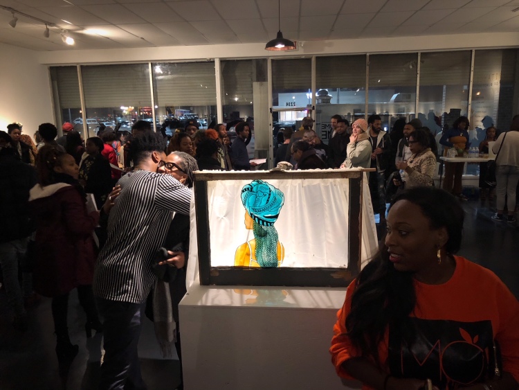 Artists and guests mingle at the opening of the CMPLX gallery and studio space in Orange Mound. 2019. (Cole Bradley)
