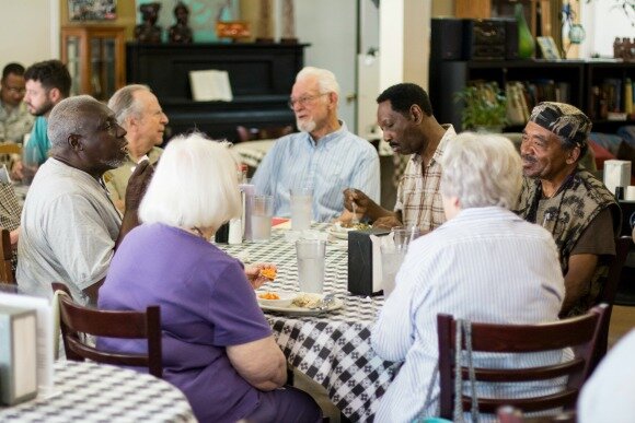 Diners at Caritas Village, 2016. (Lauren Taylor)