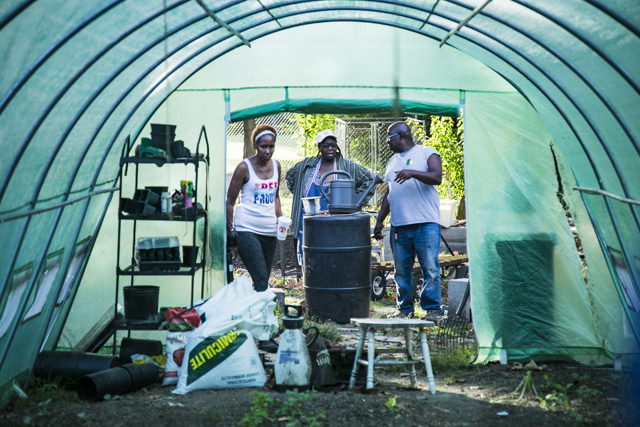 Left to Right: Dana Merriweather, Judy Conway, and Sidney Johnson at the Mitchell Heights community garden and plant nursery, 2018. (Natalie Eddings) 