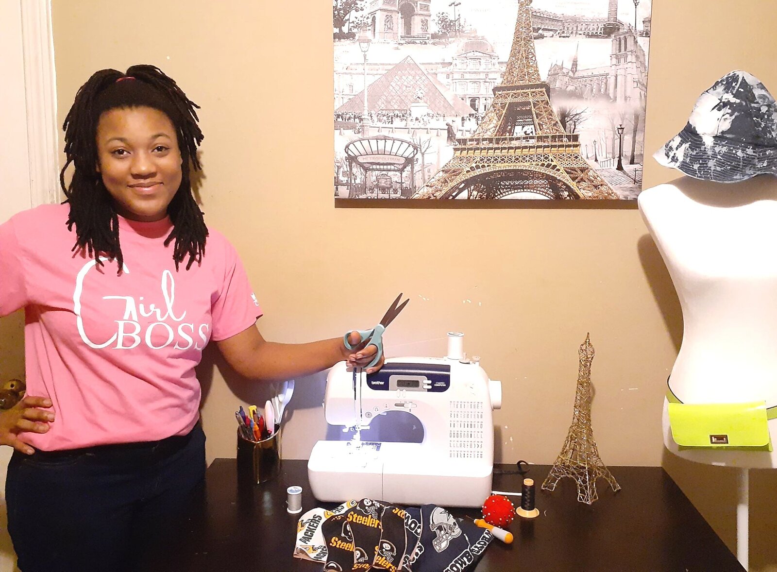 Imani Polk, 14, in her home office where she designs and manufactures a line of fashion mask, Masked by Imani. The masks are made from high-quality, durable fabrics and available with or without filters. Polk estimates she's sold over 350. (Submitted) 