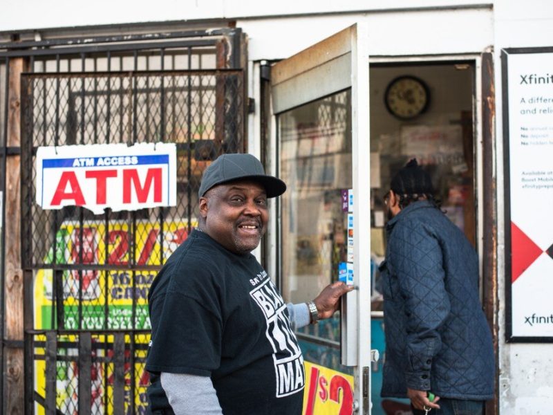 Rufus Sykes cracks a smile as he holds the door open for a customer at the South Memphis Grocery on West Mallory Avenue. Sykes co-owns the corner store with other family members. (Malik Martin)