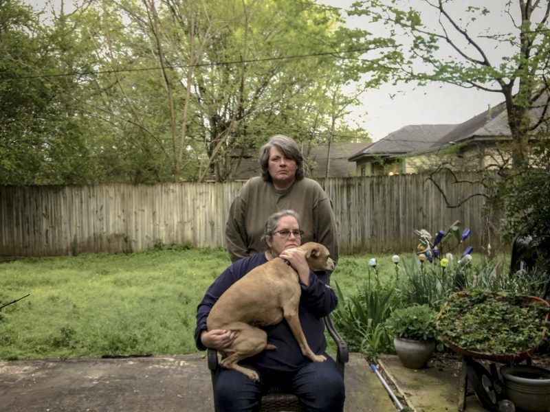 Eileen Castine (seated) and her partner Ricci at their home. Self portrait by Eileen Castine. Self-portrait by Castine.