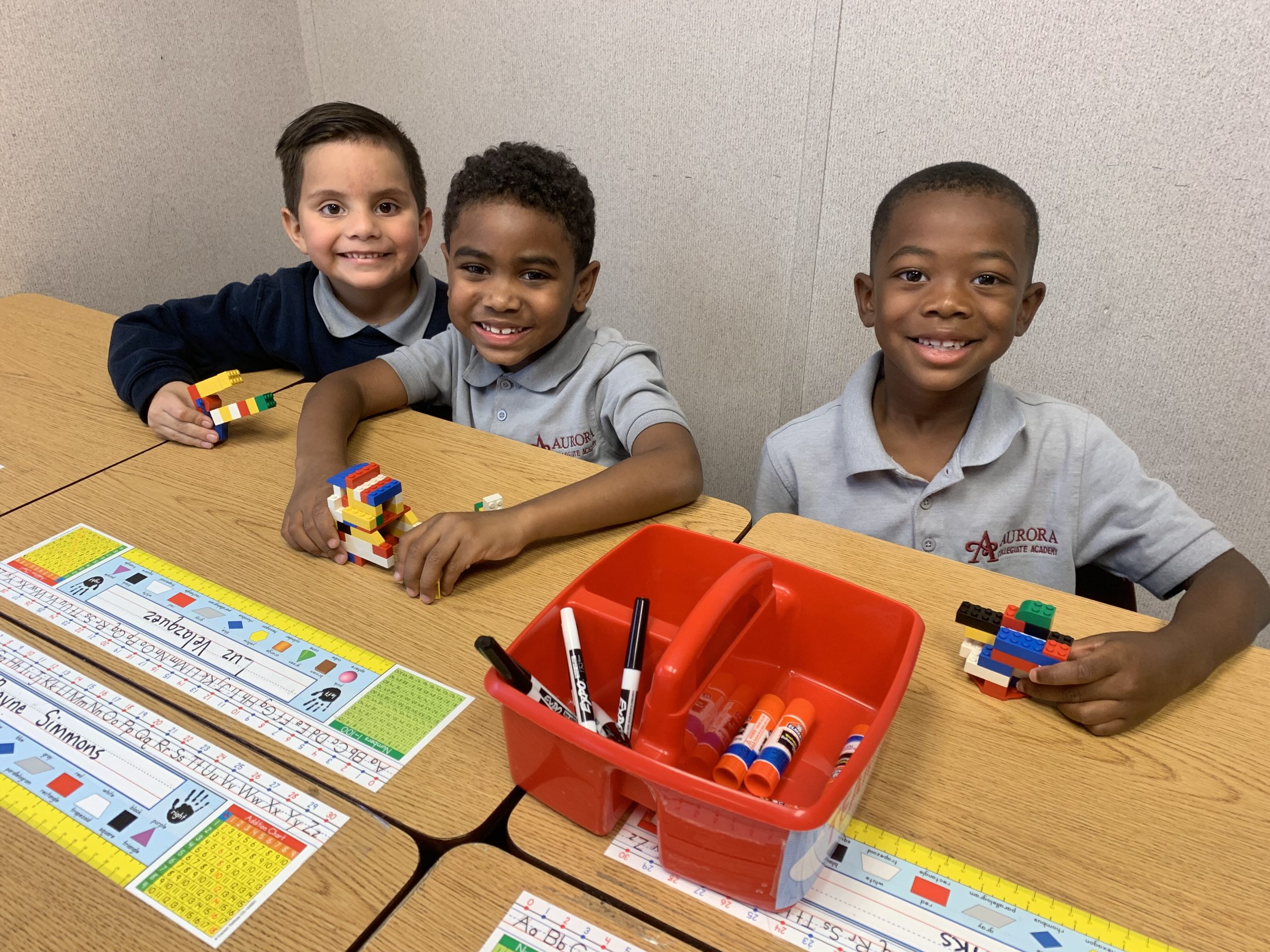 (L to R) Aurora Collegiate Academy first grade scholars Uriel Martinez, Roman Gibson and Jace Banks. (Cat Evans)