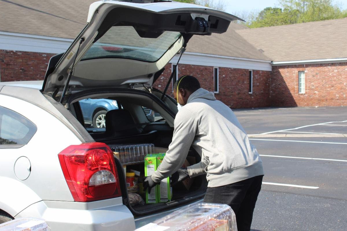 A Neighborhood Christian Center volunteer preps meals for families in response to COVID-19. (Submitted)