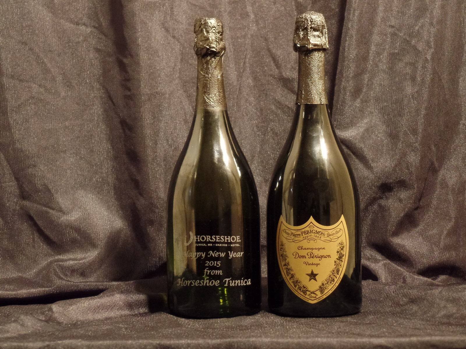 C & J Trophy and Engraving offers custom branding and engraving on a wide variety of items and materials, including these wine bottles. (C & J Trophy and Engraving)
