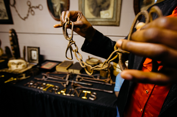 Dr. Carnita Atwater holds up one of the New Chicago CDC's most important and unsettling artifacts. The infant-sized shackles were used during the transatlantic slave trade. (Ziggy Mack)