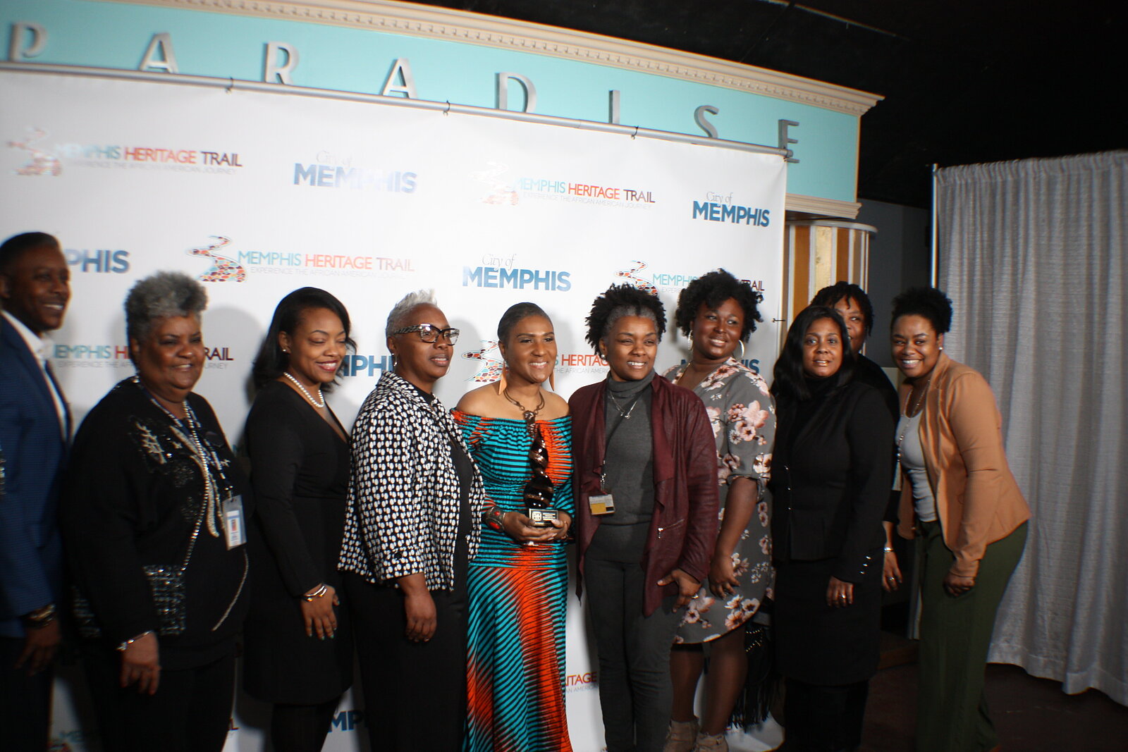 Staff and supports of the Young Actors Guild pose for a photo after the awards ceremony. Founder Chrysti Chandler stands center holding her award. (Cole Bradley) 