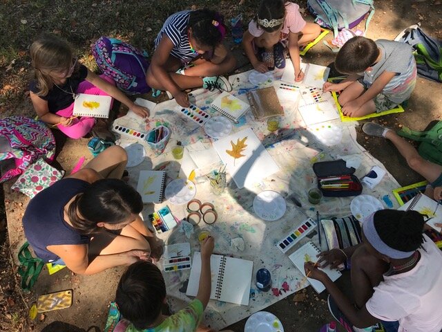 Students learn about science through outdoor nature study led by a parent volunteer. (Sarah Gong)