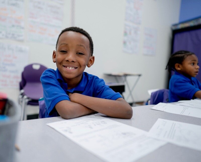 An Aspire Public Schools' student takes a break from his work to pose for a photo. (Aspire Public Schools)