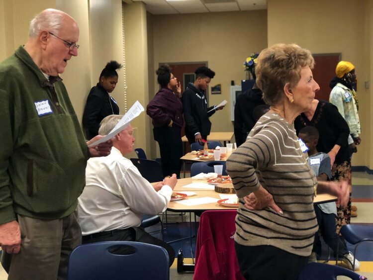 Congregants of the Highland Heights Baptist Church and The Avenue Community Church join together for a Thanksgiving dinner and service. Both groups share space in their historic church. (Heights CDC)