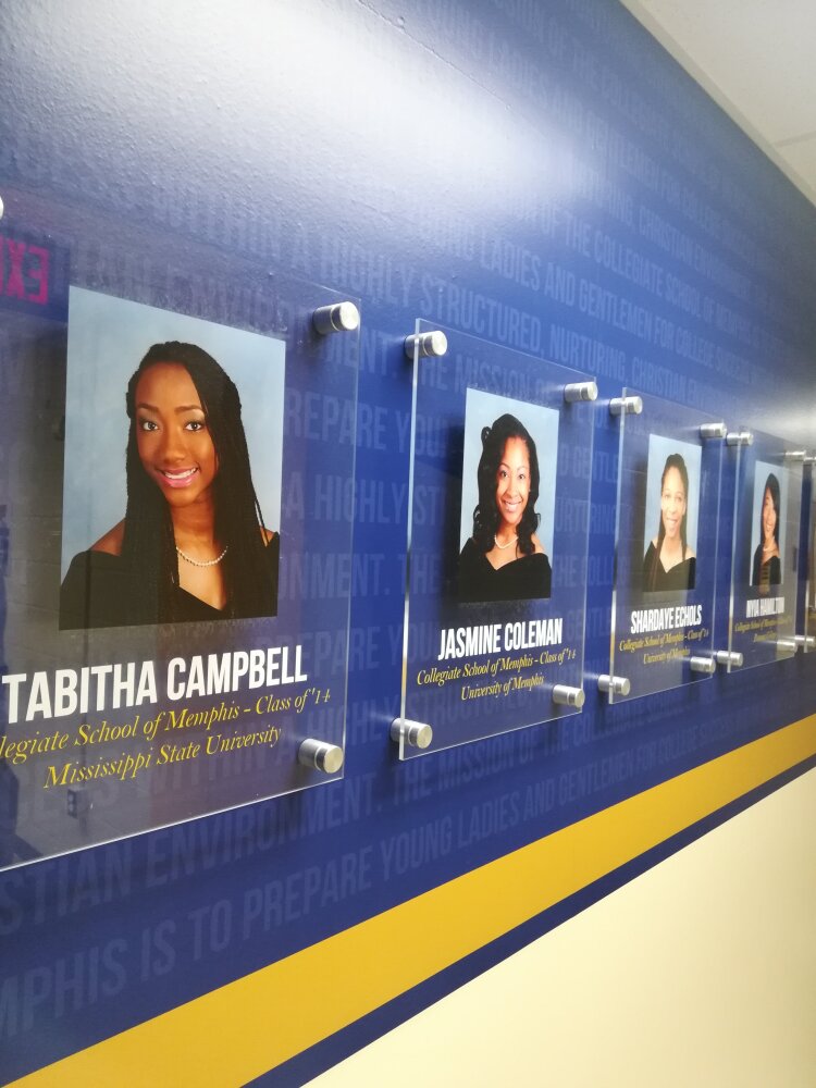 Collegiate School of Memphis displays portraits of alumni who have graduated college on its "Mission Accomplished" wall. CMS is located in one of The Heights' oldest churches. (Leigh Tatum)