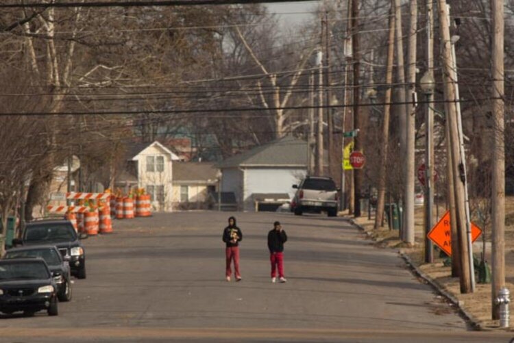 Young men walk along a North Memphis street. (Ziggy Mack) 