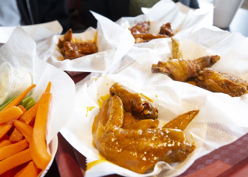 At D'Bo's Wing n' More, the wing challenge tasters sampled regular hot, suicide hot, honey gold, and seasoned wings. (Ziggy Mack)
