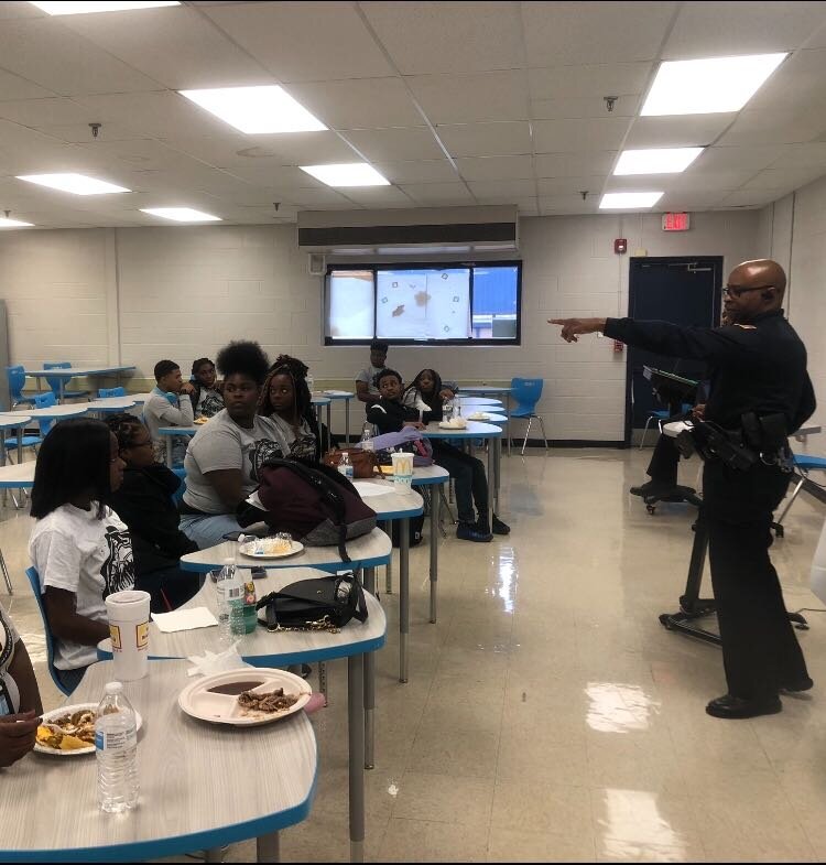 Patrolman Derrick Muhammad leads a discussion safe and healthy responses to stress and anger. (A.J. Dugger)