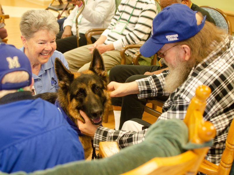 Handler San Chambers and therapy dog Batman are favorite regular visitors at Dorothy's Place. The day house is operated by  Alzheimer's and Dementia Services of Memphis, Inc. (Cat Evans)