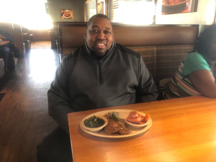 Terrance Adams prepares to tuck into his lunch at Southern Hands Homestyle Cooking located at 6025 Winchester Road. (A.J. Dugger III)