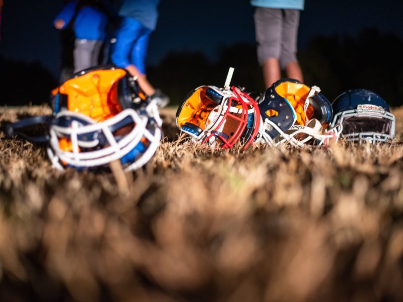 Ridgeway Cougars helmets rest in the grass during practice. (Malik Martin)