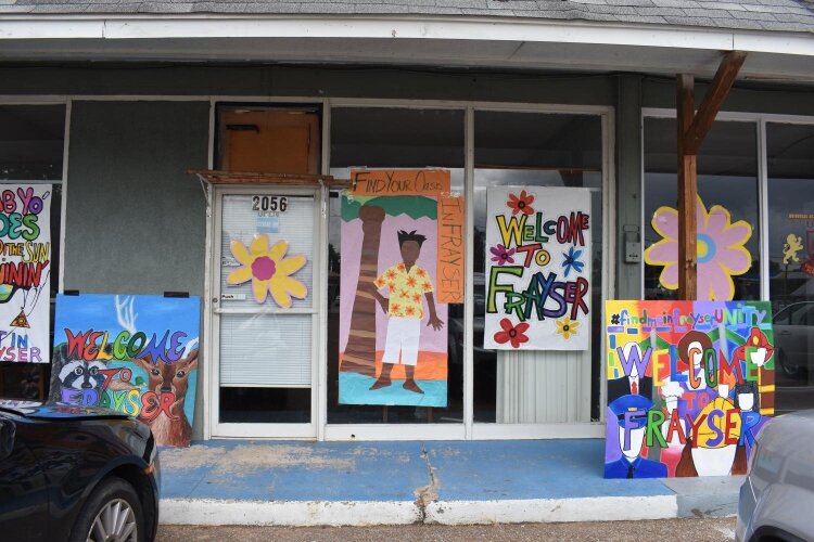 Art by Frayser residents decorates a local store front. (Arkwings Foundation)