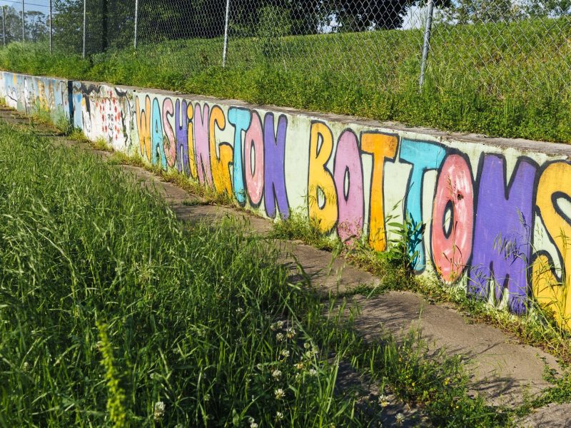 A mural still marks the location of the Washington Bottoms Community Park and Garden at the corner of North Watkins and Court streets. (Ziggy Mack)