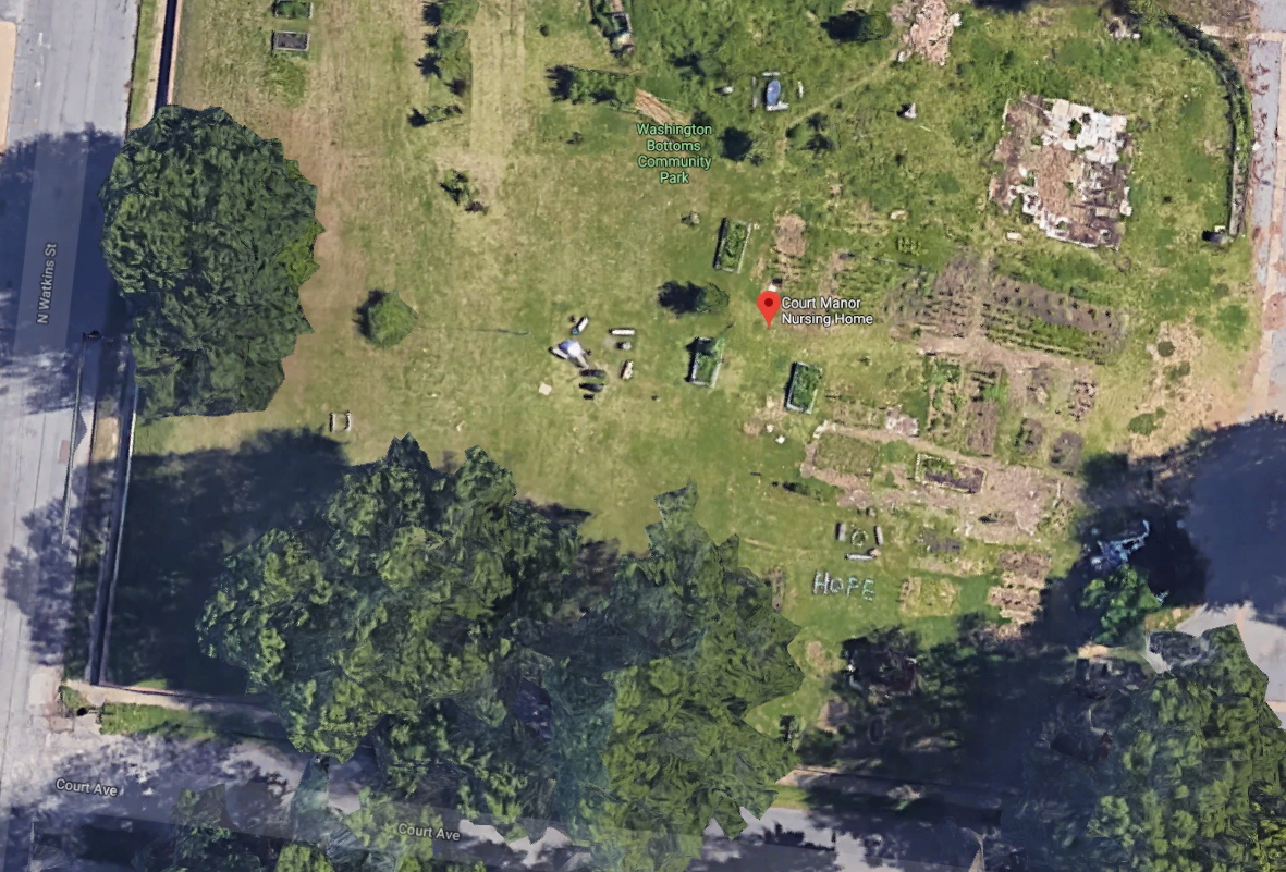 Google satellite images show the remnants of the Washington Bottoms Community Park and Garden at the corner of Court and N. Watkins streets. The property is owned by Tennessee Health Management. The garden was founded by Homeless Organizing for Power and Equality or H.O.P.E. Towards the lower right side, the word HOPE is spelled out with rocks. (Google Maps)