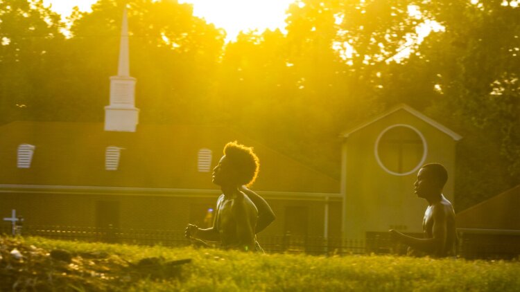 Boys run for sports conditioning along South Mendenhall Rd. in the Hickory Hill neighborhood. (Ziggy Mack) 