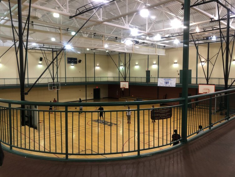 Neighborhood residents play basketball at the Hickory Hill Community Center. The center opened in 2003. (A.J. Dugger III)