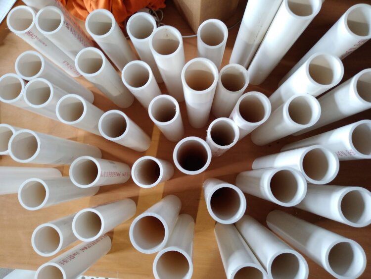 White tubing waits to be decorated by the Creatives in Research team and lashed together to become umbrella stands for the Rain or Shine umbrella-share public art project in Madison Heights. (Wonder / Cowork / Create)