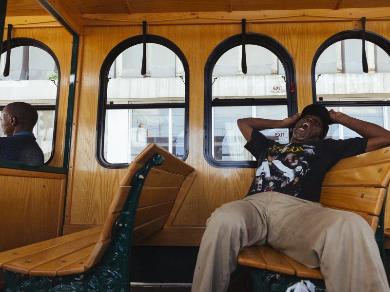 Self-identified street activist and Madison trolley line passenger Larry White yawns big between conversations with other passengers. (Ziggy Mack)