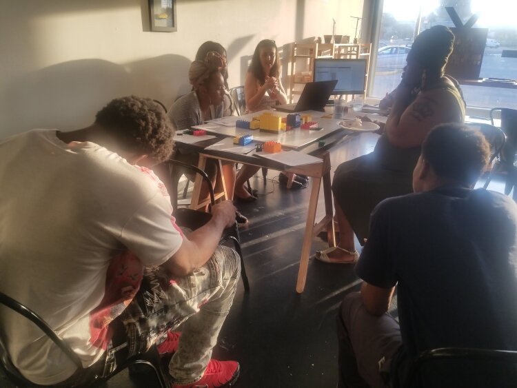 A group works together to develop a hypothetical town called Yorktown at the July 17 urban planning workshop hosted by ULI Memphis and JUICE Orange Mound. (Baris Gursakal) 