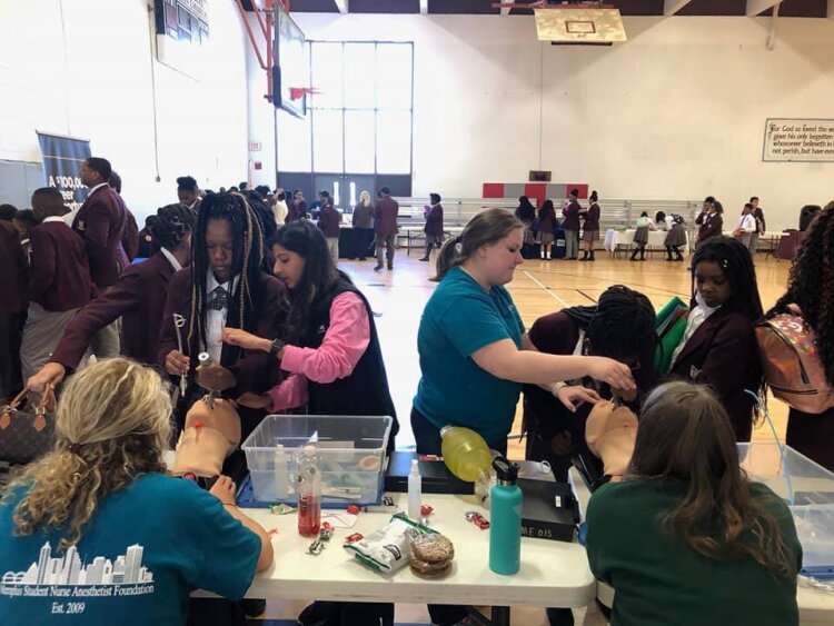 MASE students practice intubating a patient alongside nurse anesthetists at a MASE career day. (Submitted)