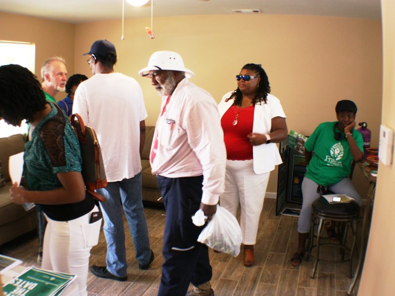 Guests of the Frayser CDC open house toured the homes and picked up literature for buying one of the three current homes or the 27 more that Frayser CDC hopes to build in the next two years. (Cole Bradley)