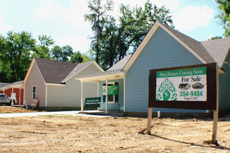 Two of the three new homes at the corner of Whitney and Woodland Terrace were on display for the July 13 open house. (Cole Bradley)