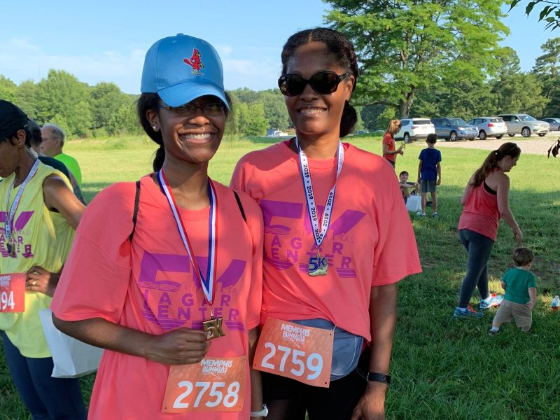 Stephanie Parker-Bradley and her daughter, Faith Bradley, celebrate after completing The Hagar Center 5K Fun Run. (Ashlei Williams)