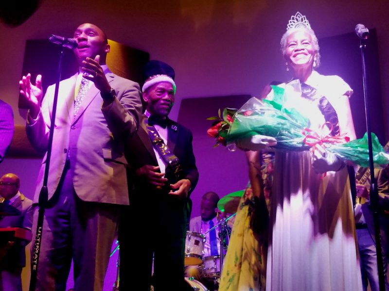 Shelby County Mayor Lee Harris (L) presents the Senior Prom's 2019 Prom Queen Everlena Yarborough. Prom King Clarence Christian watches with pride. (Baris Gursakal)