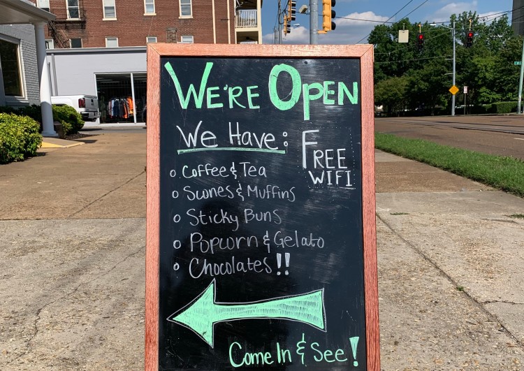A sandwich board entices commuters on Madison Avenue to step inside Phillip Ashley Chocolates at Madison and North Bellevue. (Brandi Hunter) 