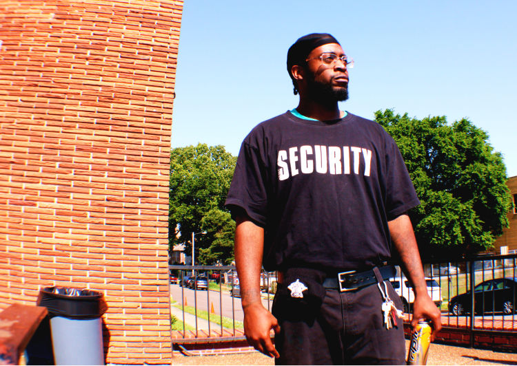 Thomas Allen is a contract security guard and has been working in Madison Heights for roughly three months. He's pictured here on the steps of Friends for Life, a community education and support organization for people living with HIV and AIDS. It is located at 43 North Cleveland Street. (Cole Bradley)