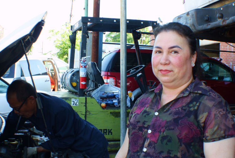 Trihn Nguyen (R) and her husband, Thong (L), co-own Thong's Auto Repair located at 54 North Cleveland Street. The couple moved to the area and opened the business in 1997 after immigrating from Vietnam. (Cole Bradley)