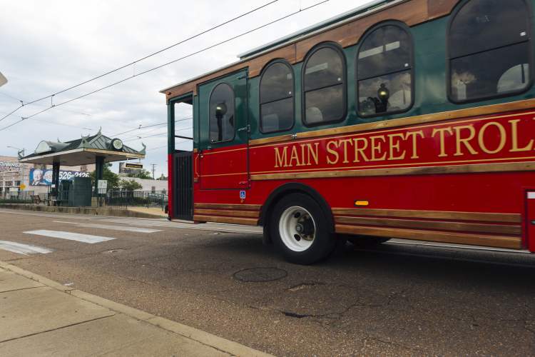 A modified bus designed to look like a trolley drives past the trolley stop on Madison Avenue just west of Cleveland Street. Memphis' trolley line runs from downtown to Madison Heights. (Ziggy Mack)